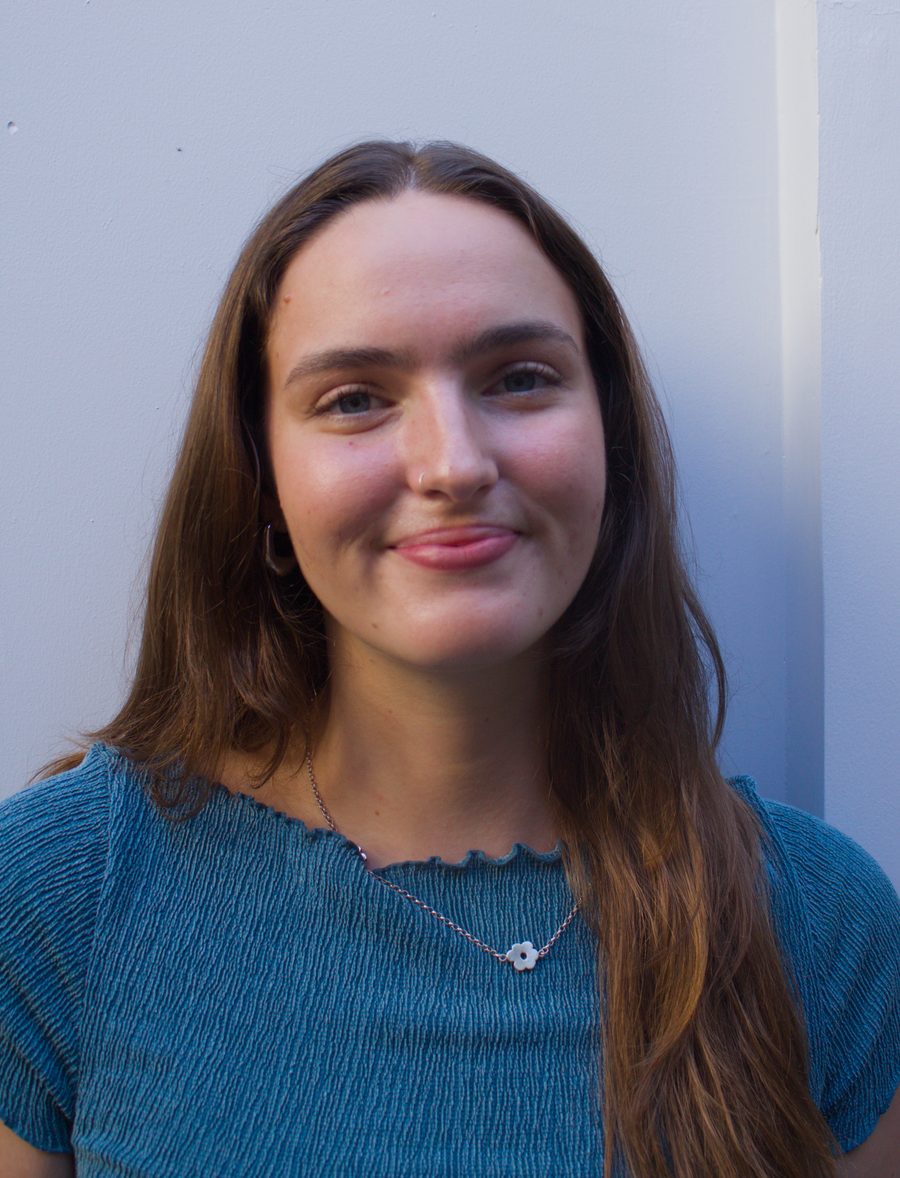 Emelia smiling, wearing a blue top